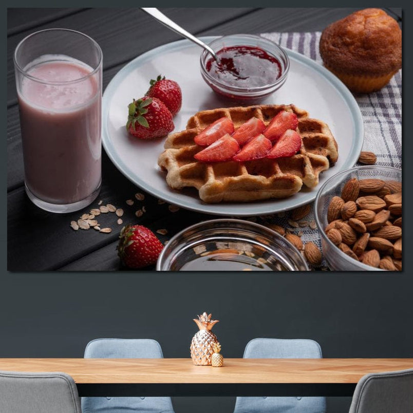 tablou canvas cu un mic dejun dulce, cu o vafa si capsuni, o briosa, migdale si un milkshake, pe o masa de lemn neagra