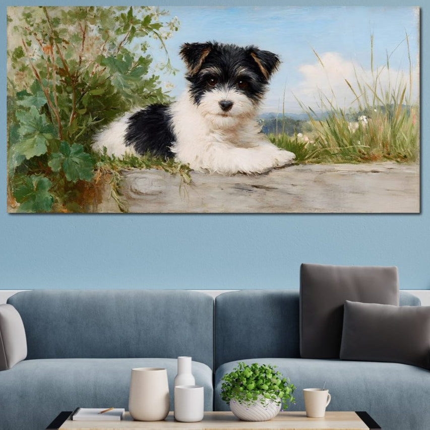 tablou canvas cu un catelus alb-negru, asezat intr-un decor natural cu frunze si iarba, pictat in nuante blande