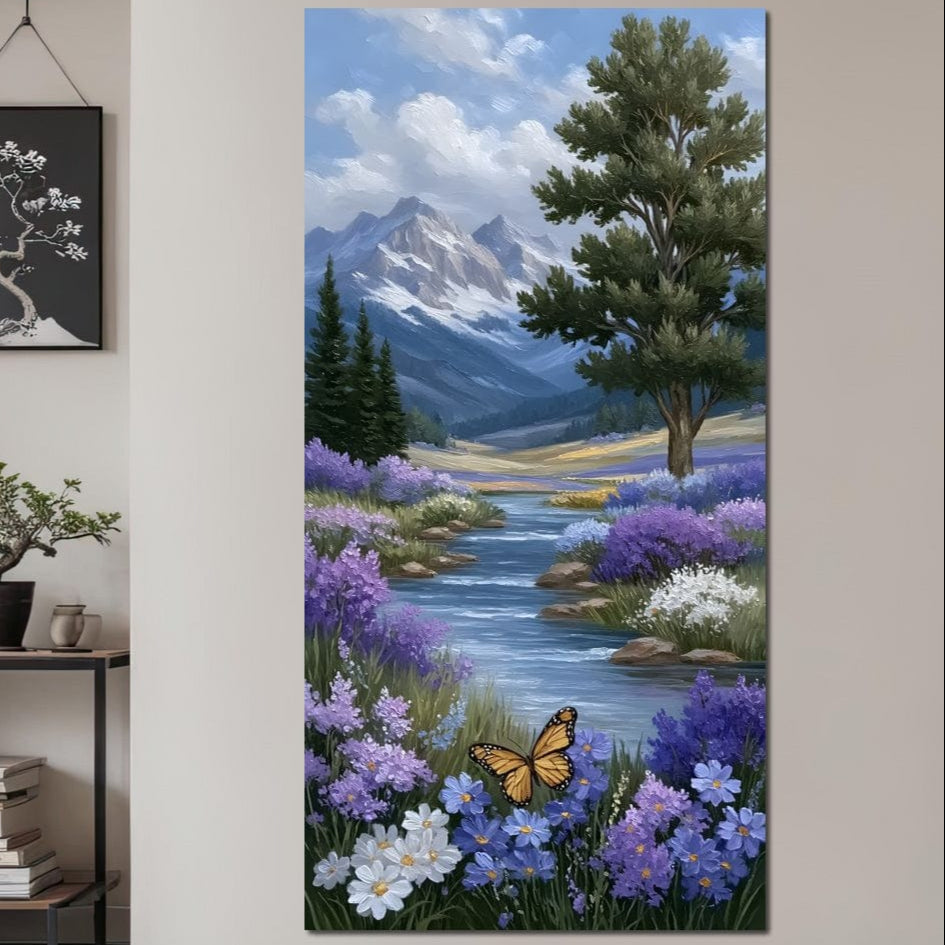 tablou canvas cu un fluture zburand deasupra unui rau cu flori violet, intr-un peisaj montan
