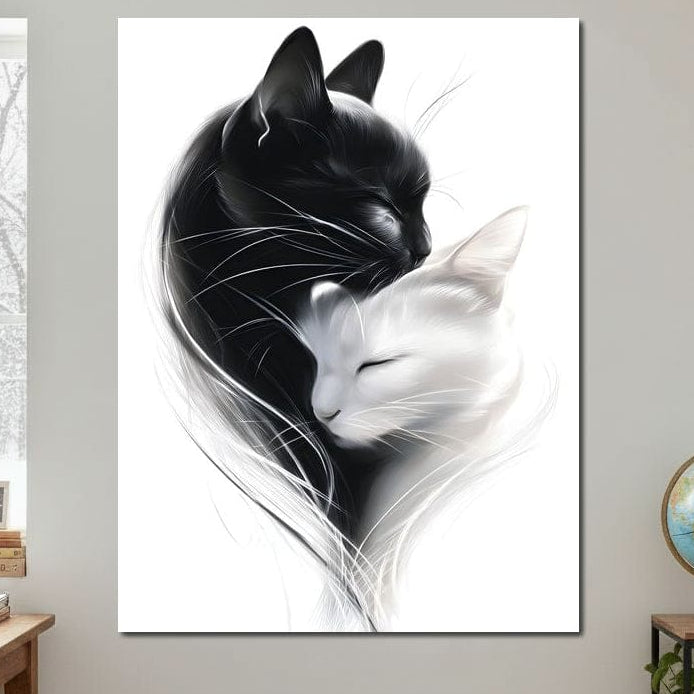 tablou canvas cu o pisica alba si una neagra, imbratisate intr-un cadru alb