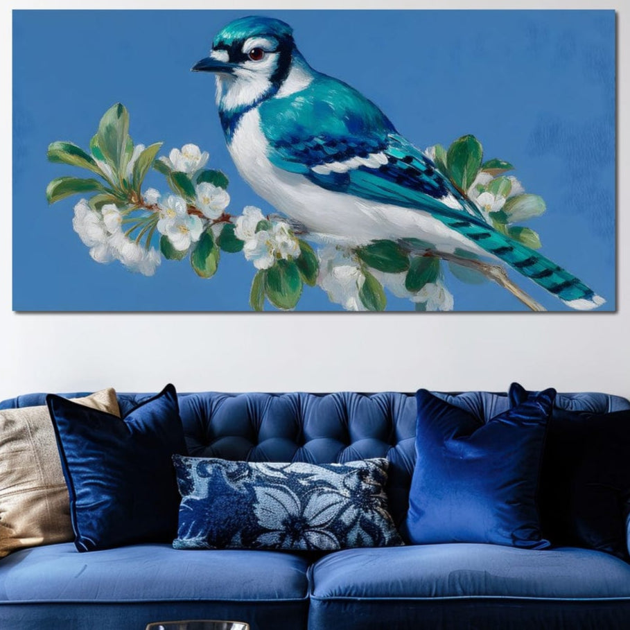 tablou canvas cu o pasare albastra pe o ramura cu flori albe, pe fundal bleu in stil pictura