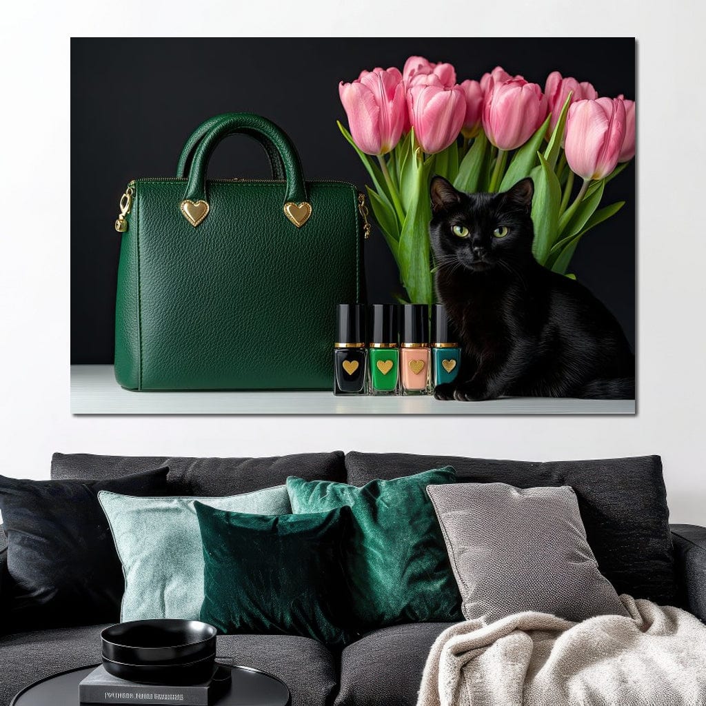 tablou canvas cu o pisica neagra langa o geanta verde smarald si sticlute de oja, pe fundal negru cu un buchet de lalele roz
