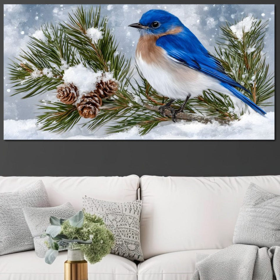 tablou canvas cu o pasare albastra pe o crenguta de brad acoperita cu zapada, pe fundal de peisaj de iarna