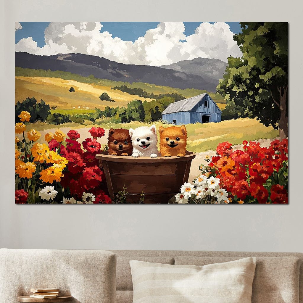 tablou canvas cu trei catelusi intr-un butoias de lemn in mijlocul unei gradini inflorite, pe fundal de dealuri aurii si un hambar albastru