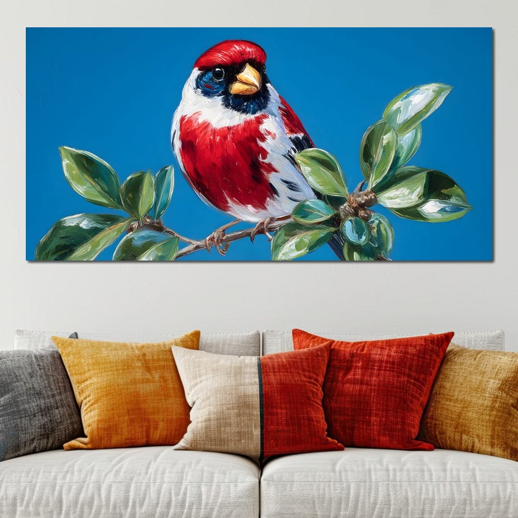 tablou canvas cu o pasare rosie cu accente albe si negre, asezata pe o ramura cu frunze verzi pe fundal de cer senin