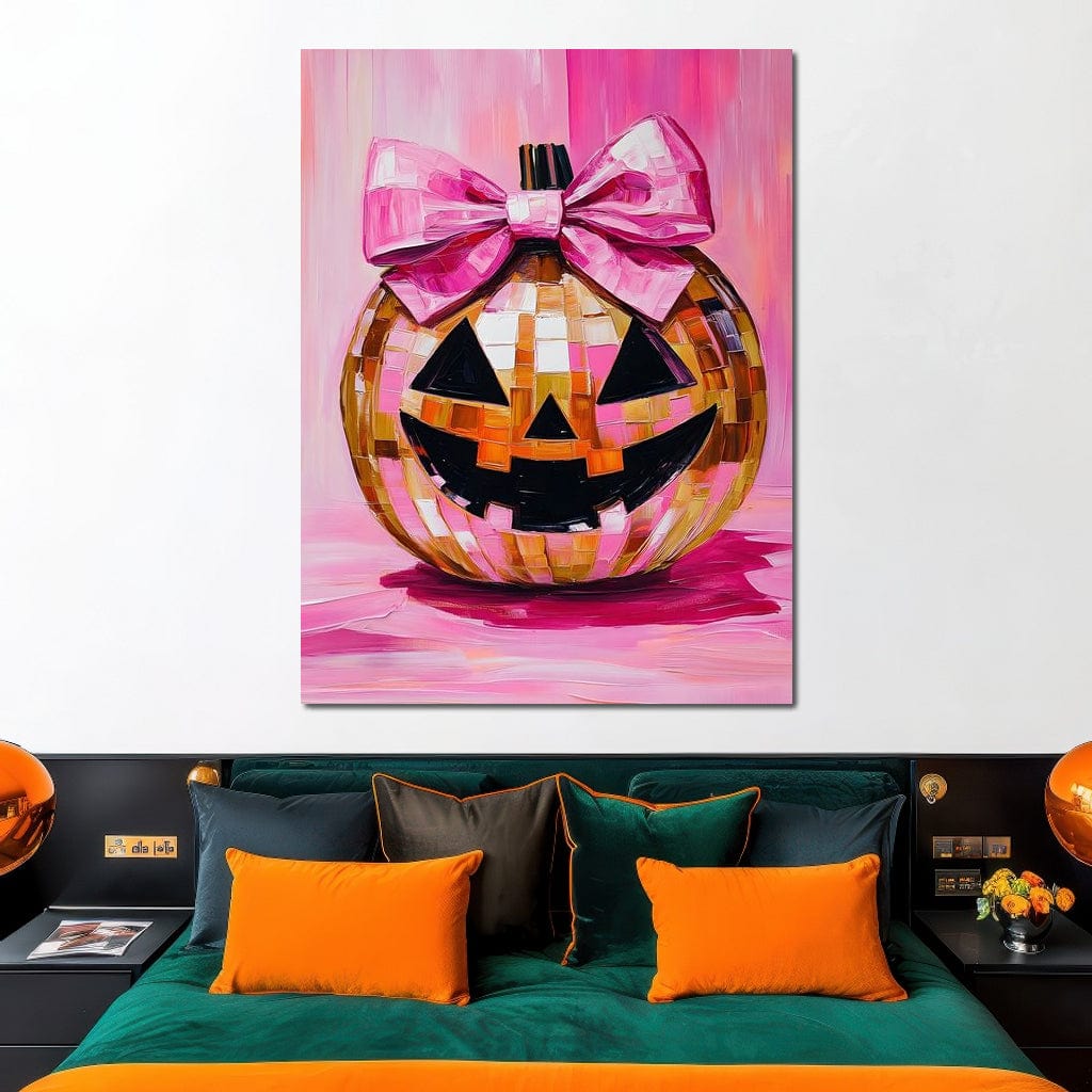 tablou canvas cu un dovleac decorat de Halloween cu fundita roz, pe fundal roz aprins