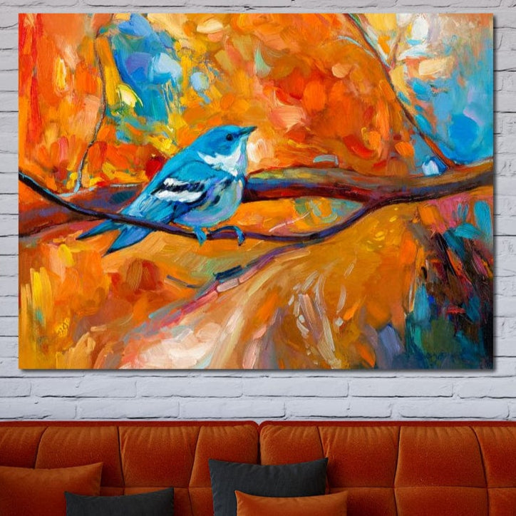 tablou canvas cu o pasare albastra pe creanga, in peisaj de toamna colorat