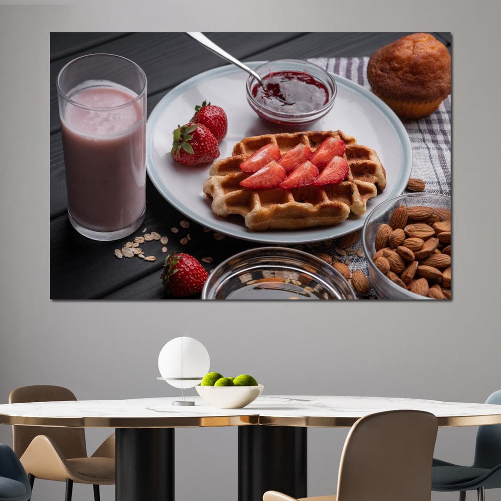 tablou canvas cu un mic dejun dulce, cu o vafa si capsuni, o briosa, migdale si un milkshake, pe o masa de lemn neagra