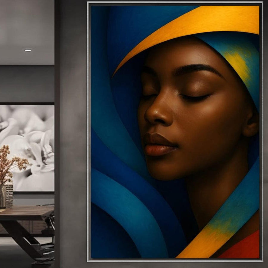 Un Tablou Canvas Premium LuxCanva®, "Sub Pleoapele Lunii" (G1134), cu nuanțe de albastru și portocaliu care descriu seninătatea și meditația, atârnă într-un birou modern, alături de o fotografie florală alb-negru.