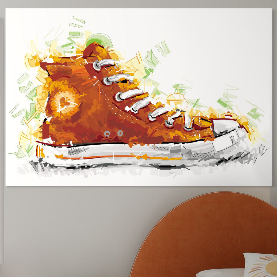Tablou Canvas Premium LuxCanva® B1123, cu tenisi Converse portocalii și culori vibrante, este așezat pe un perete deschis la culoare deasupra unei tăblii portocalii curbate. Brand: LuxCanva®.