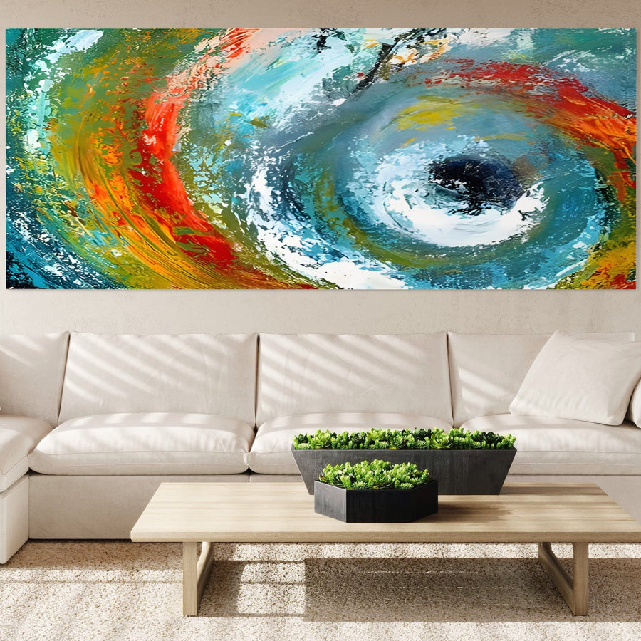 Un living modern cu o canapea secțională albă, o măsuță de cafea din lemn deschis cu ghivece de plante și tabloul LuxCanva® Tablou Canvas Premium A1310 "Vartejul Culorilor" în tonuri abstracte multicolore vibrante agățat deasupra canapelei.