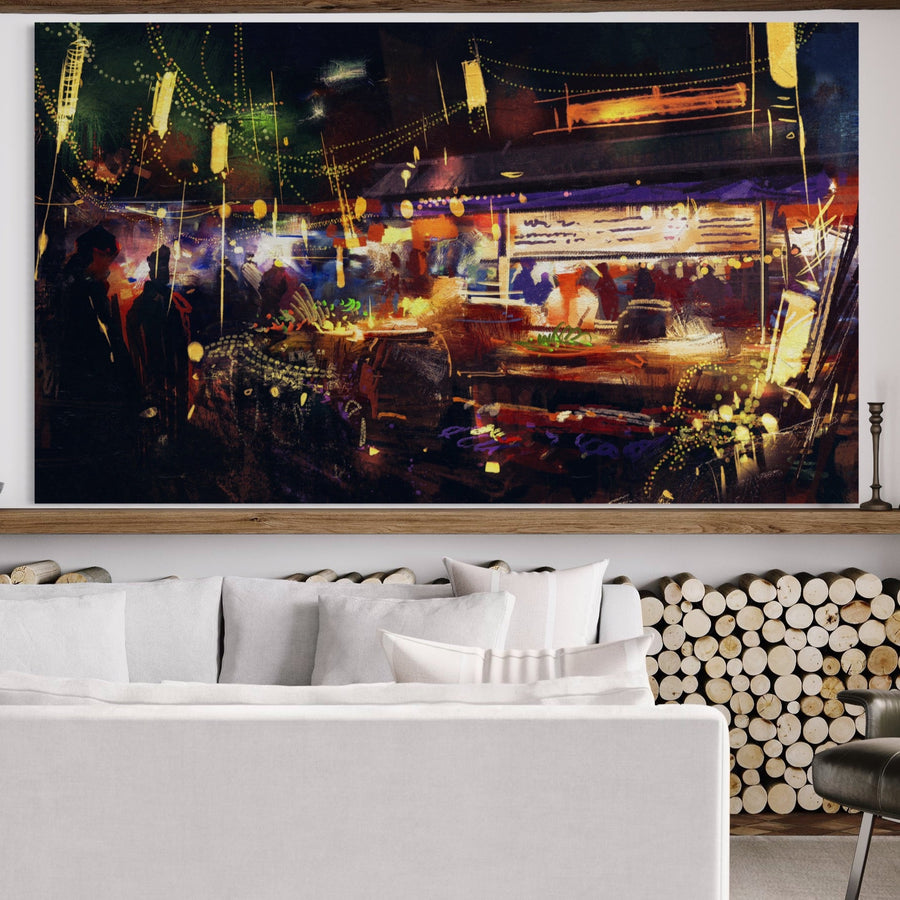 O cameră de zi modernă, cu o canapea ușoară și lemne de foc stivuite, are LuxCanva® Tablou Canvas Premium LuxCanva® A1290-Colorful Market, o artă de perete abstractă cu culori vibrante, oameni și lumini deasupra canapelei.