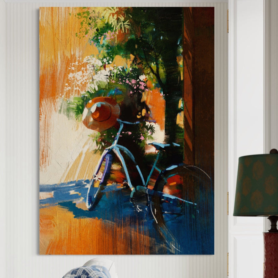 Pânza LuxCanva® Tablou Premium LuxCanva® A1264 prezintă o scenă vibrantă a unei biciclete albastre cu o pălărie maro lângă un copac colorat și flori strălucitoare - perfectă pentru a adăuga căldură și energie decorului dormitorului dvs.