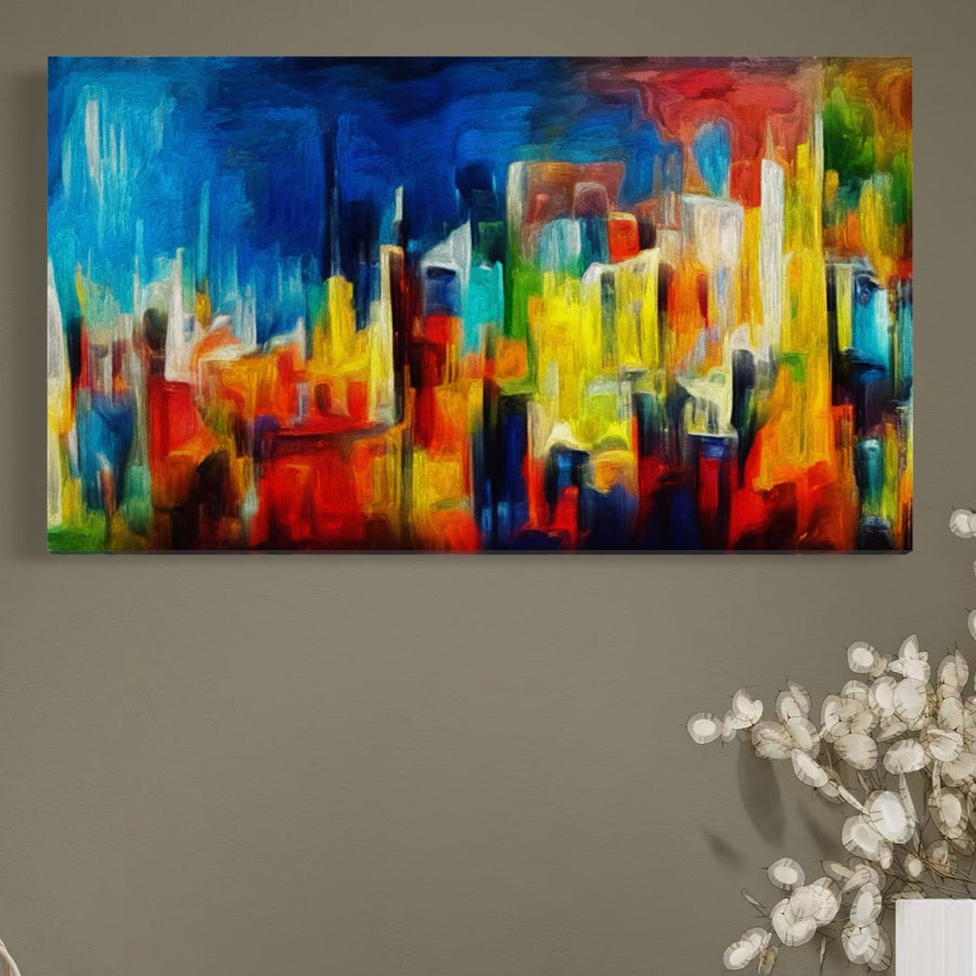 Tablou Canvas Premium LuxCanva® C1098, un peisaj urban abstract vibrant cu culori îndrăznețe, de la LuxCanva®, atârnă pe un perete bej deasupra florilor false decorative albe. Perfect pentru relaxare în camera de zi sau dormitor.