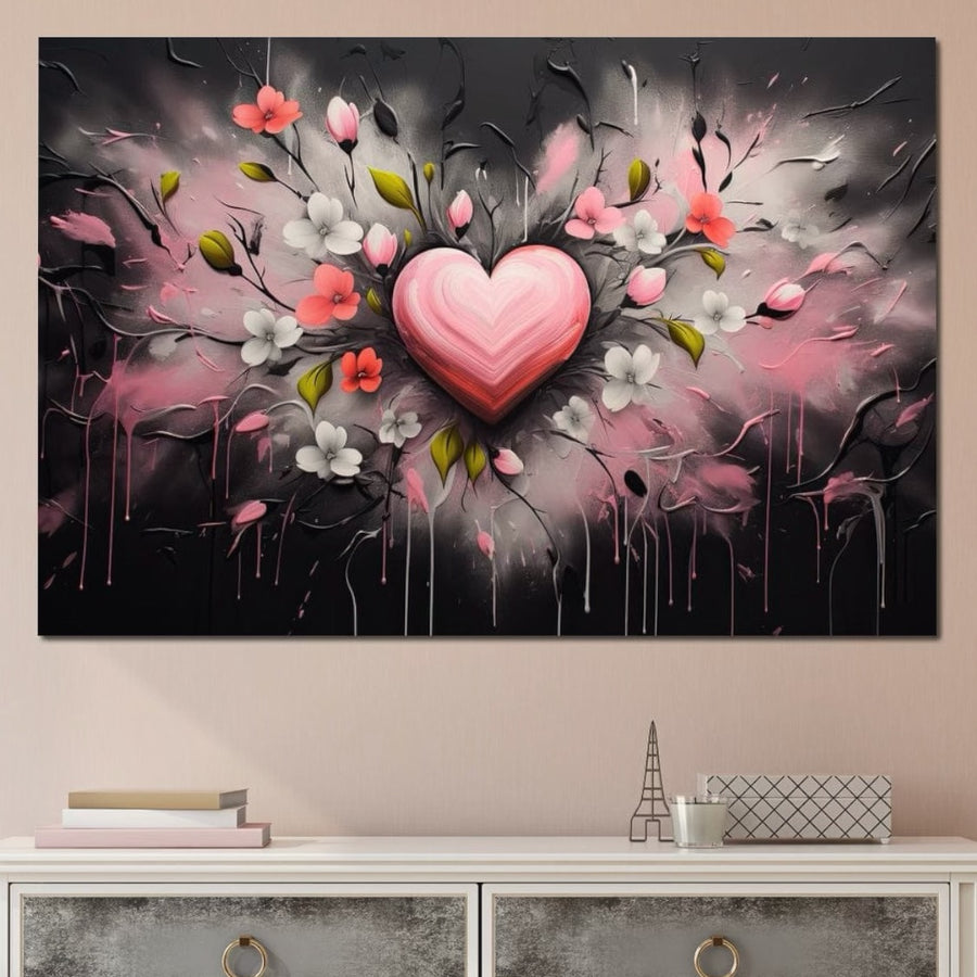 Tabloul LuxCanva® Tablou Canvas Premium E1009, "Rasaritul Inimii in Floare", prezintă o inimă roz printre flori vibrante pe o pânză de înaltă calitate, amplasată pe un fundal întunecat cu stropi - arta romantică ideală pentru camera dvs. de zi.