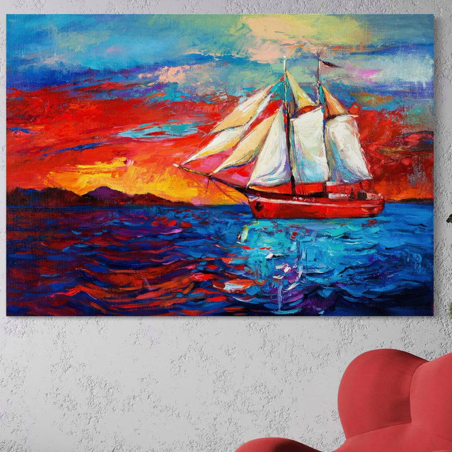 The LuxCanva® Tablou Canvas Premium LuxCanva® A1061, "Vapor Cu Vele", prezintă un peisaj abstract cu mare albastră și vapor roșu, în culori vibrante, expus pe un perete alb texturat deasupra unui scaun roșu.