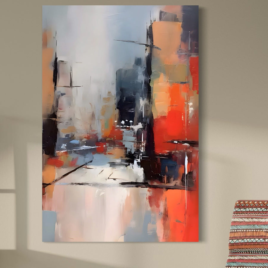 Tablou Canvas Premium A1600 de la LuxCanva® prezintă un peisaj urban abstract cu tușe vibrante de portocaliu, roșu, negru, alb și gri. Această piesă de decor premium adaugă o notă izbitoare peretelui oricărei camere de zi.
