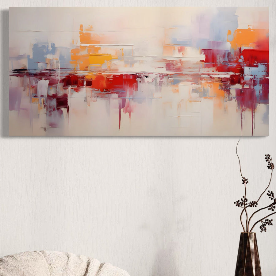 Tablou Canvas Premium LuxCanva® A1622, Cromatica, cu tușe abstracte vibrante, decorează un perete deschis deasupra unei canapele cu textură bej, completat de o vază înaltă cu ramuri uscate în dreapta. Ideal pentru camere de zi sau dormitoare.