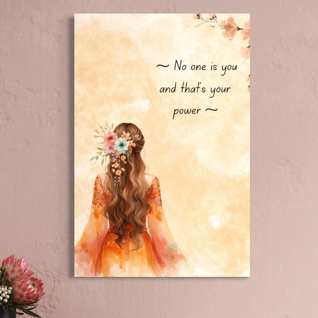 tablou canvas cu o femeie cu parul decorat cu flori, pe fundal deschis bej cu mesaj motivational