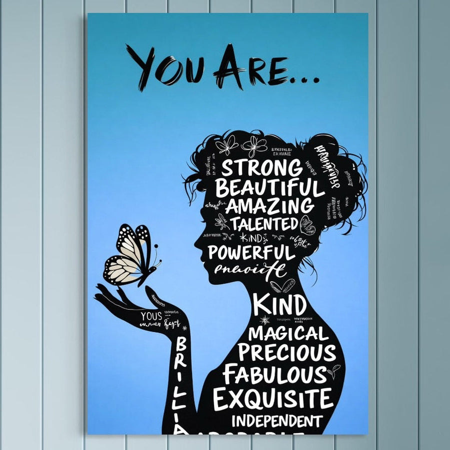 LuxCanva® Tablou Canvas Premium, Identitate Inflorita (Q1037): o siluetă feminină cu fluture și cuvinte motivaționale precum încredere și optimism, pe fund albastru. Print de calitate premium, ideal pentru birou sau dormitor.